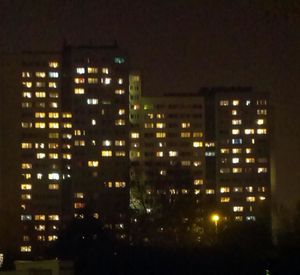 Illuminated buildings in city at night