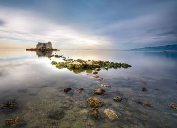 Scenic view of sea against sky during sunset