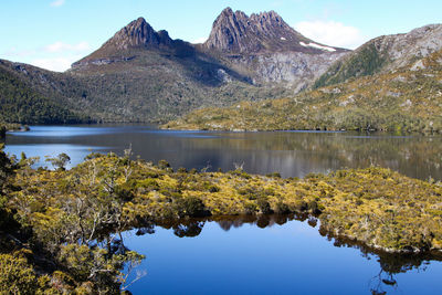 Scenic view of dove lake and mountains against sky