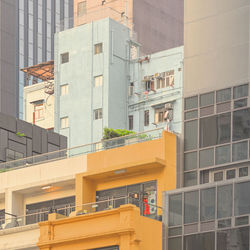 Low angle view of modern building in city against sky