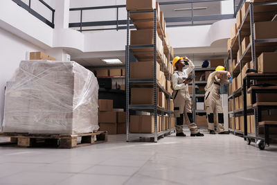 Rear view of man standing in factory