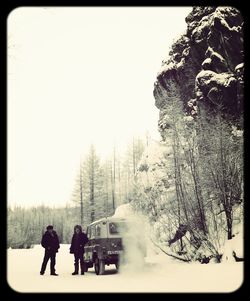 People on snow covered landscape