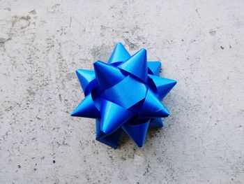 High angle view of blue paper against white background