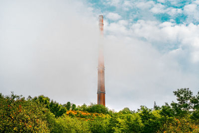 Industrial tower surrounded by mist