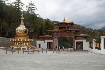 View of temple building against cloudy sky