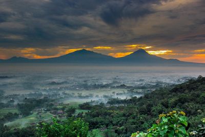 Scenic view of landscape against sky during sunset