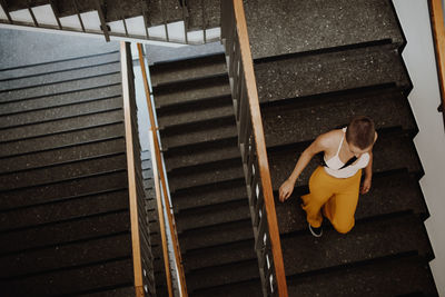 High angle view of woman on staircase