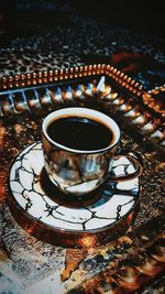 High angle view of coffee cup on table