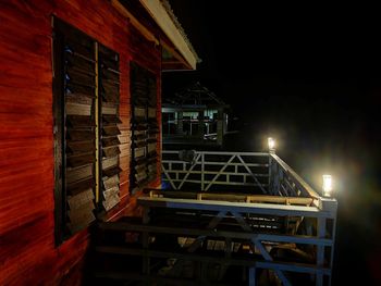 Illuminated building against sky at night