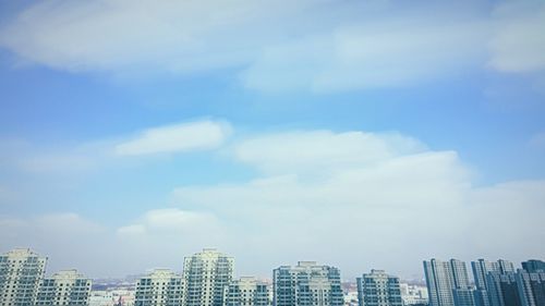 Low angle view of building against blue sky