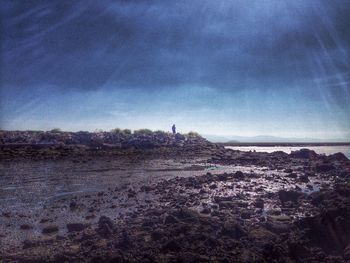 Scenic view of landscape against cloudy sky