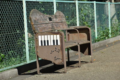 Empty bench in abandoned park