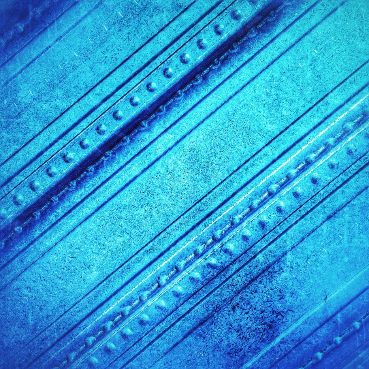 blue, full frame, backgrounds, wood - material, indoors, pattern, close-up, glass - material, transparent, day, no people, water, swimming pool, wooden, textured, high angle view, built structure, design, window