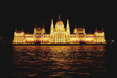 Illuminated buildings at waterfront