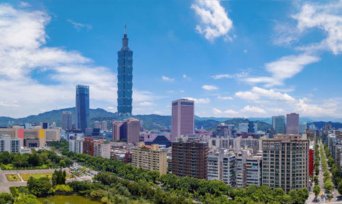 Modern buildings in city against sky