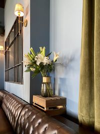 Flower vase on table at home