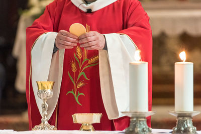 Midsection of priest in church