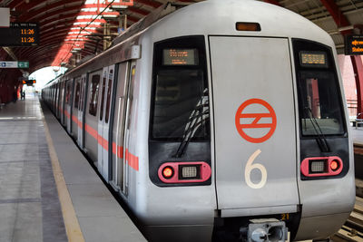 Delhi metro train arriving at jhandewalan metro station in new delhi, india,asia, public metro train