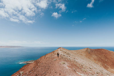 Scenic view of sea against blue sky