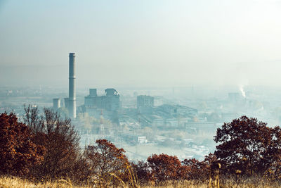 Cityscape against sky during foggy weather