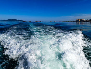 Scenic view of sea against blue sky