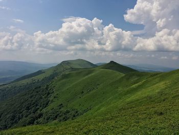 Scenic view of landscape against cloudy sky