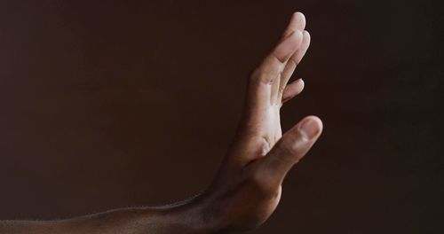 A studio photo of a black hand