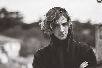 Portrait of young man standing outdoors