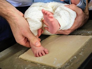 Midsection of man preparing food