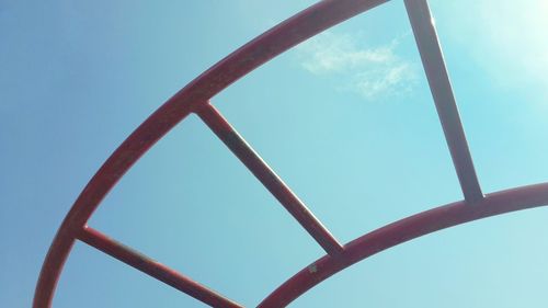 Low angle view of metal structure against sky