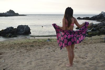 Rear view of woman on beach