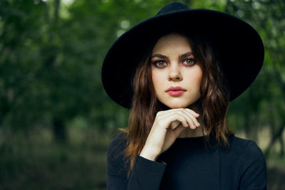 Side view of young woman wearing hat