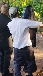 Rear view of friends walking