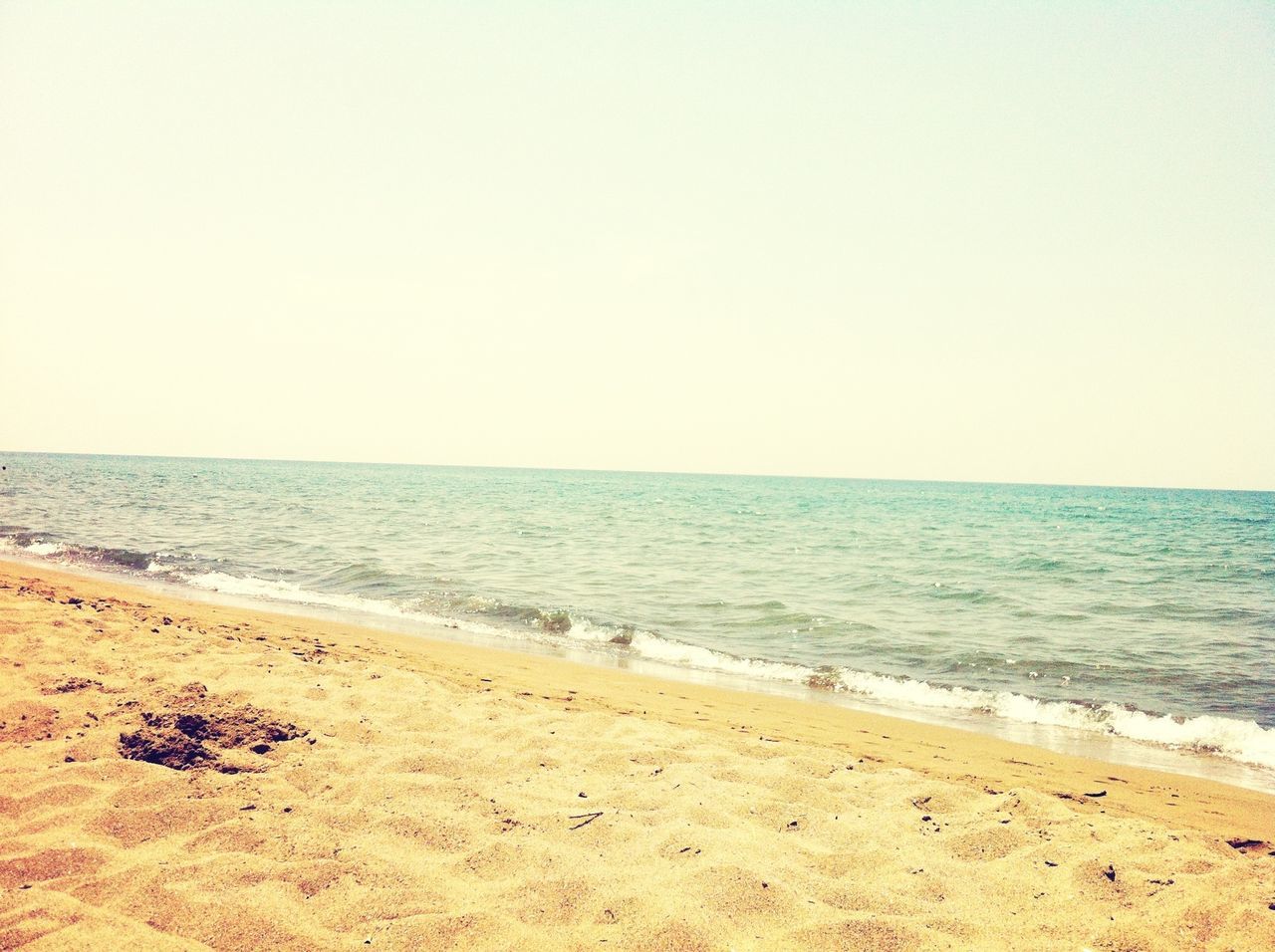 sea, horizon over water, beach, shore, sand, water, clear sky, copy space, tranquil scene, tranquility, scenics, beauty in nature, nature, wave, idyllic, sky, coastline, remote, day, vacations