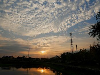 Scenic view of silhouette trees against sky at sunset