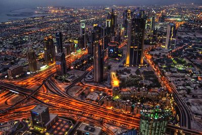 Aerial view of illuminated cityscape at dusk