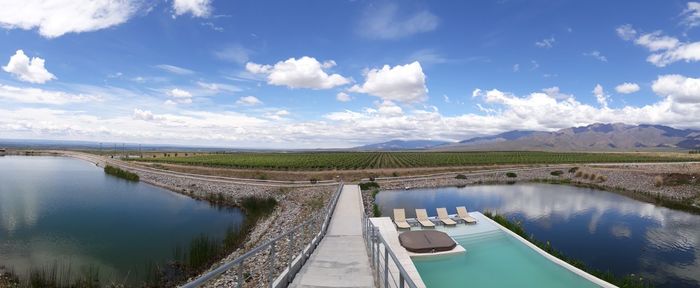 Panoramic shot of dam on lake against sky