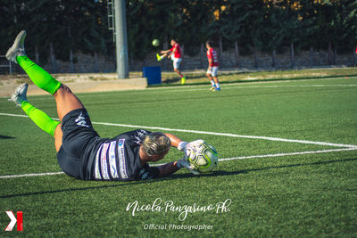 Man playing soccer on field