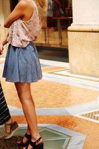 Low section of woman standing on floor