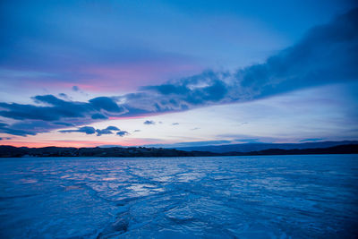 Scenic view of sea against sky at sunset