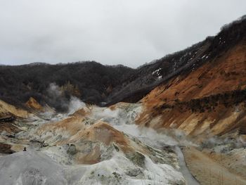 Scenic view of rocky mountains against sky