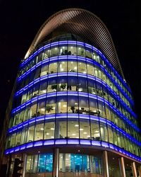 Low angle view of modern building at night