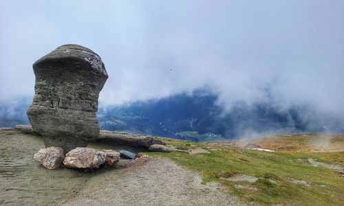 Rocks on mountain against sky