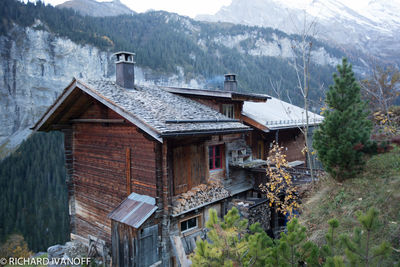 View of abandoned house against mountain range