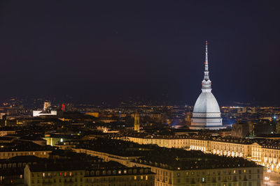 Illuminated cityscape at night