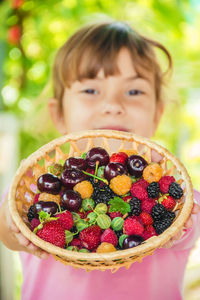 Close-up of woman holding fruit