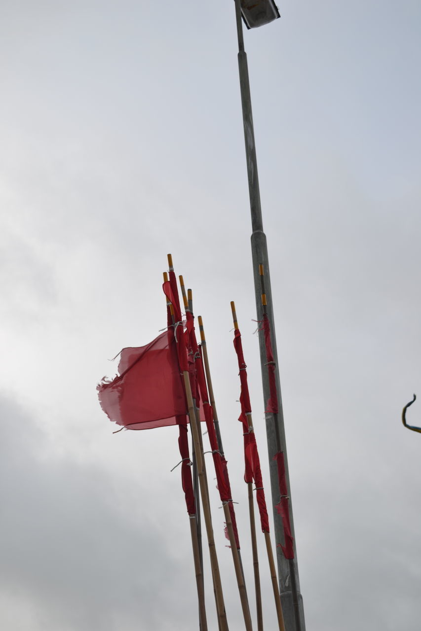 LOW ANGLE VIEW OF FLAG FLAGS AGAINST SKY