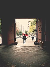 Full length of woman walking in city