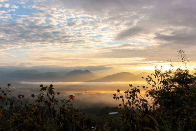 Scenic view of mountains against sky during sunset