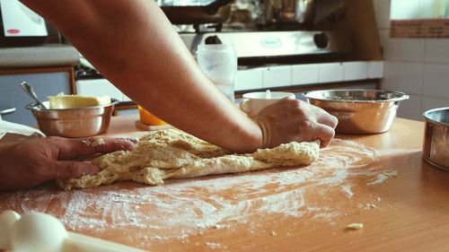 Midsection of man preparing food at home